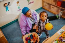 early head start caregiver with child